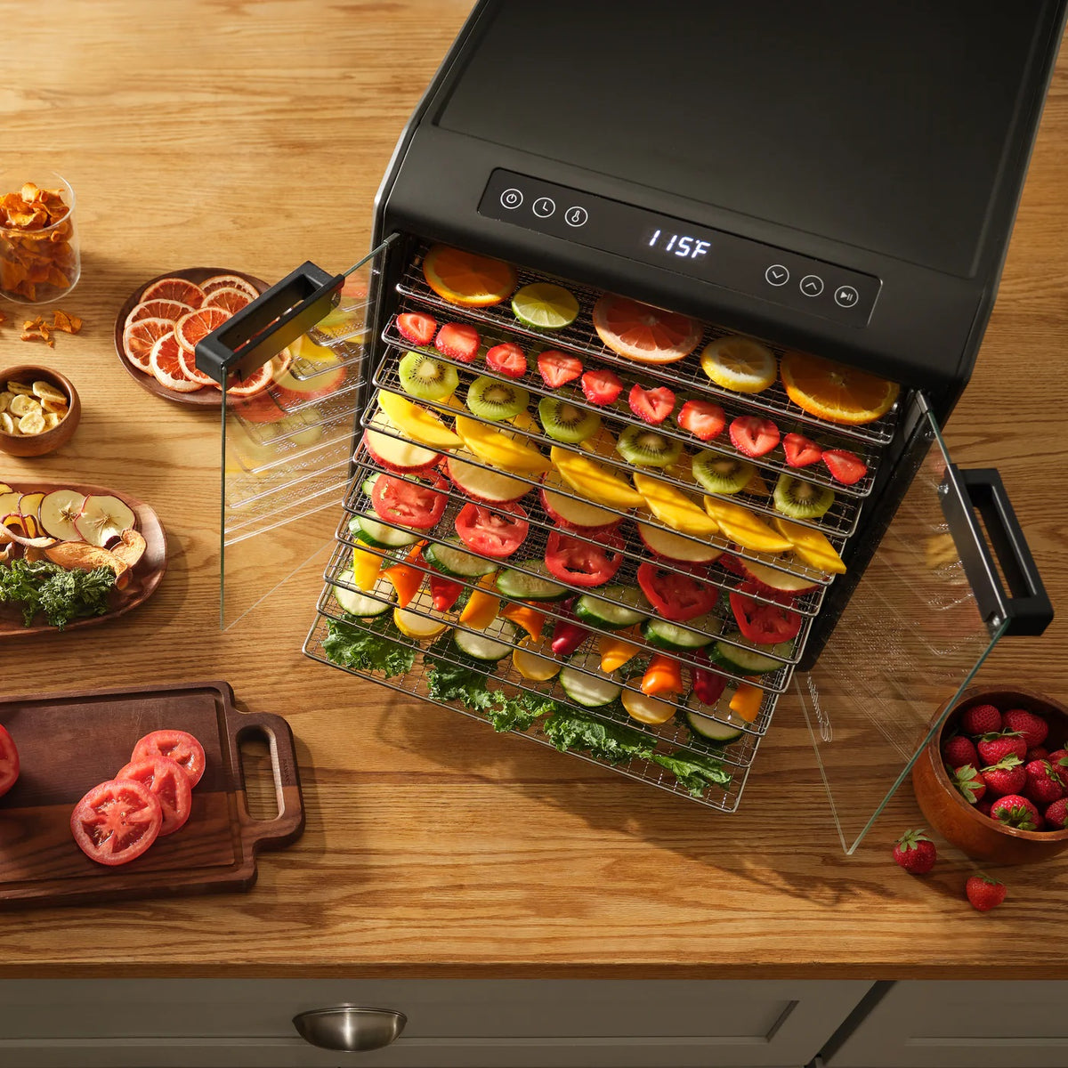 Excalibur DH10SC dehydrator on a bench with clear doors open and trays loaded with food.