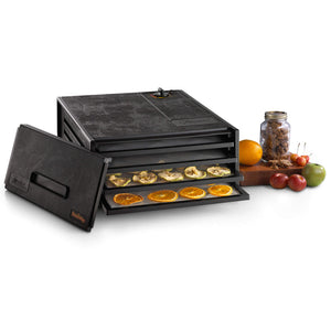 Excalibur 4400 4 tray compact dehydrator with door propped to the side and food on the trays.