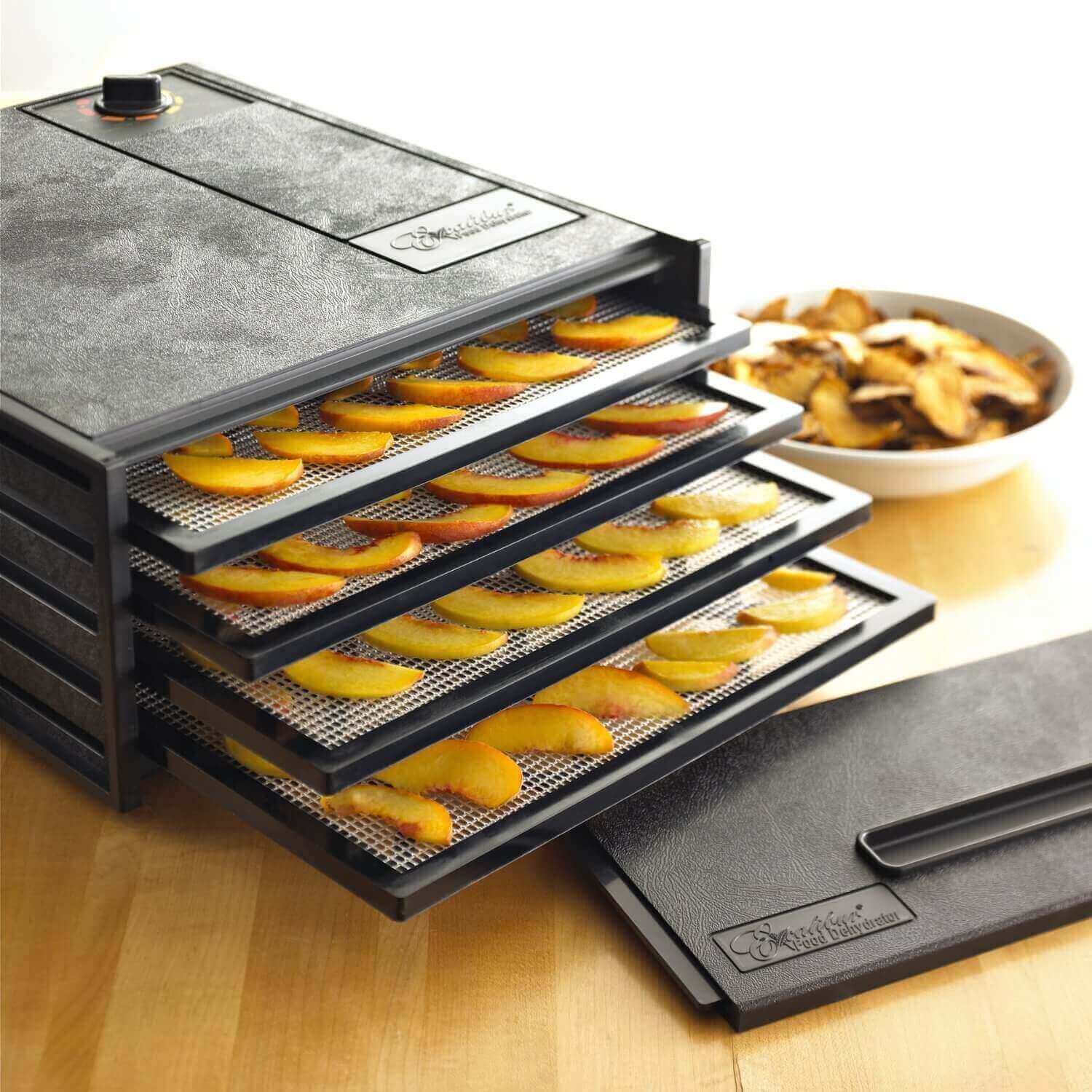 Excalibur 4400 4 tray dehydrator with fruit placed on the trays.