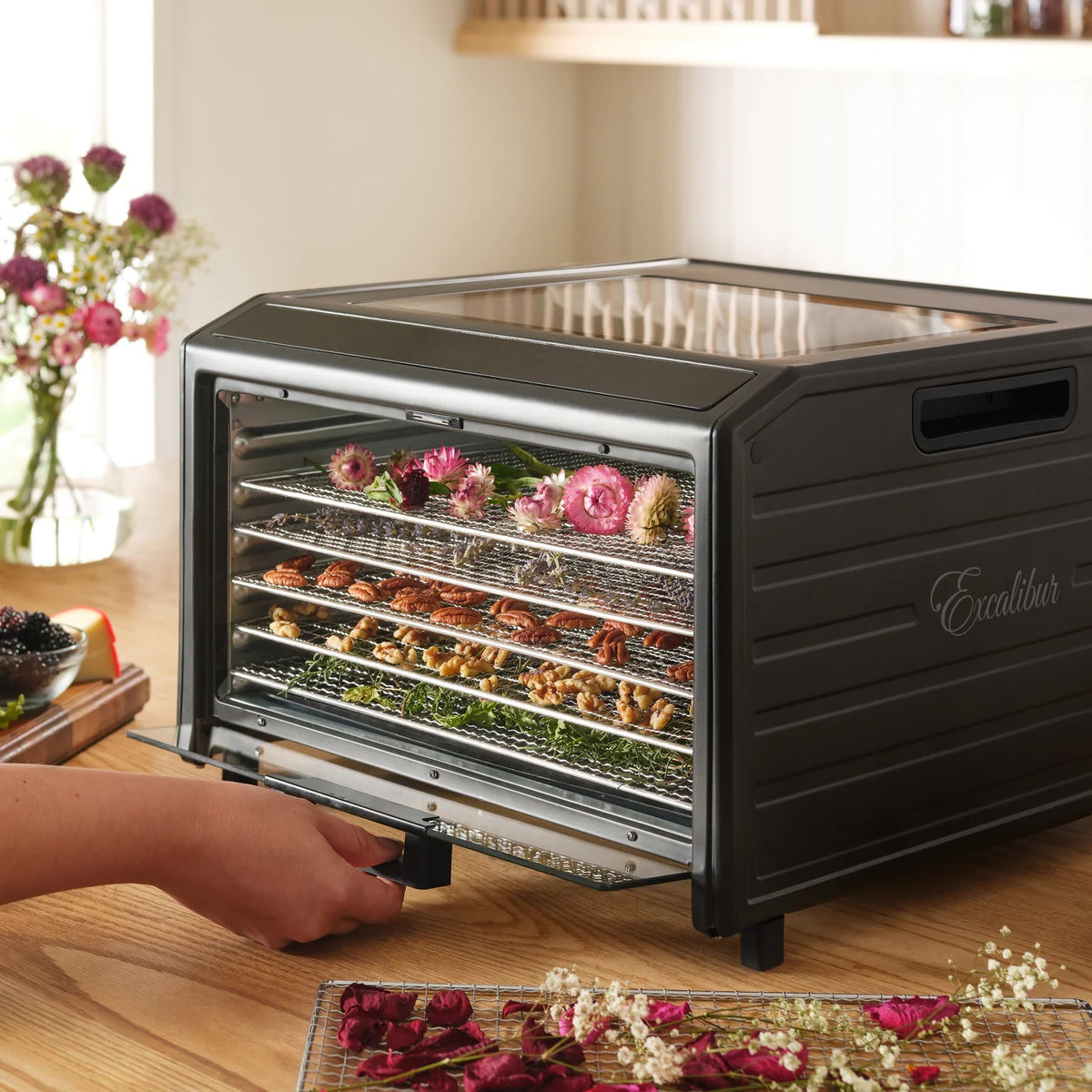 Excalibur DH06SS dehydrator with flowers on trays.