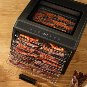 Excalibur DH06SS dehydrator with meat on pulled out trays.