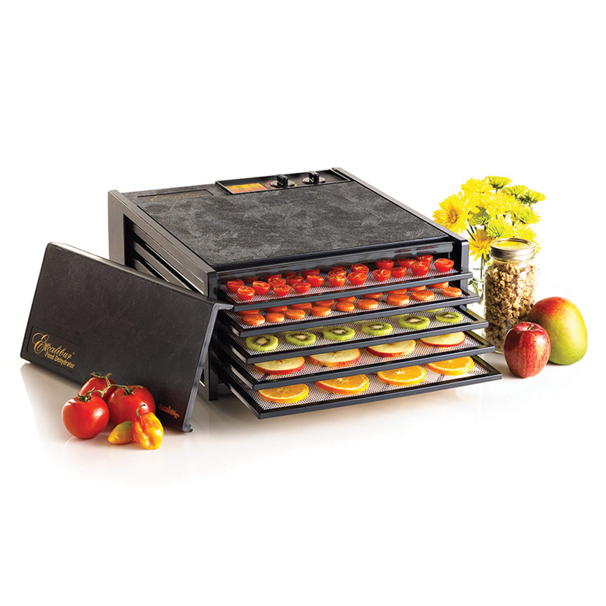 Excalibur 4526TB 5 tray dehydrator with door propped to the side and food on the trays.