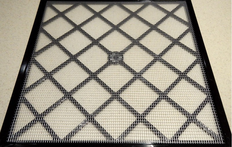 Excalibur dehydrator mesh sheet on a tray.