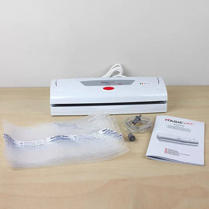 Magic Vac Alice vacuum packing system with all included accessories and parts laid out on a bench.